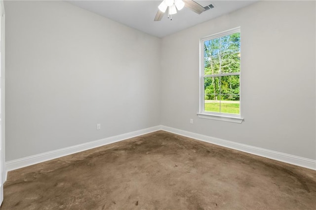 spare room with ceiling fan and a wealth of natural light