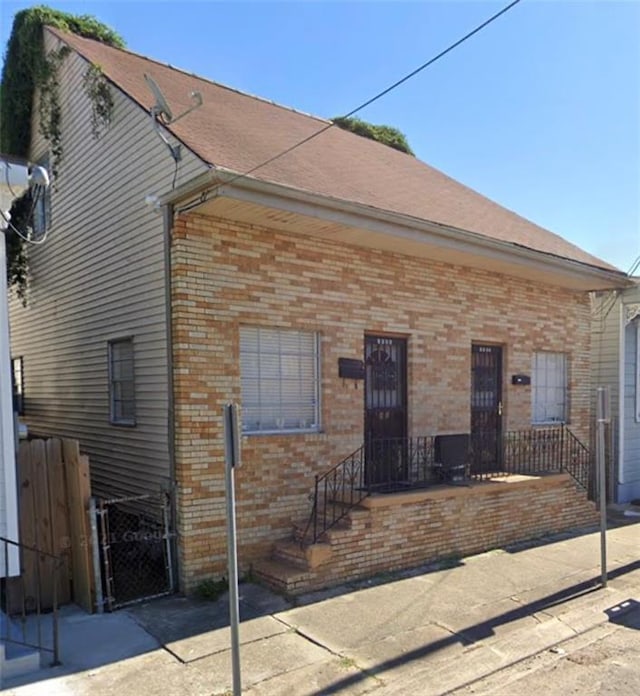 1923-25 Pauger St, New Orleans, LA 70116 - bungalow-style home featuring brick siding