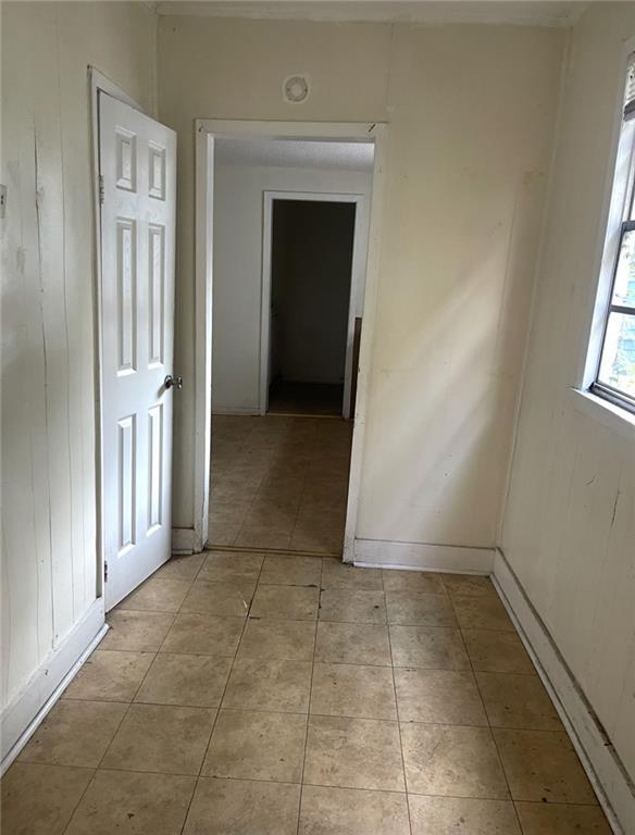 1923-25 Pauger St, New Orleans, LA 70116 - hallway with light tile patterned floors