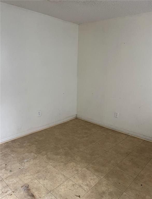 empty room with a textured ceiling