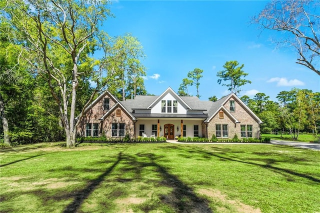 craftsman-style home featuring a front yard