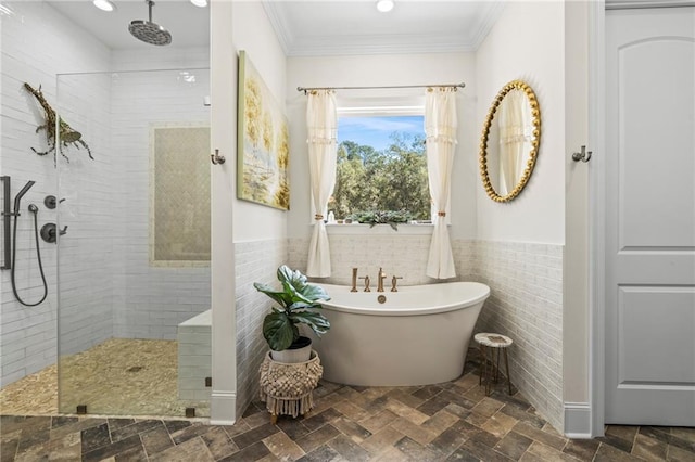 bathroom featuring shower with separate bathtub, tile walls, and ornamental molding