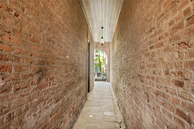 corridor with brick wall