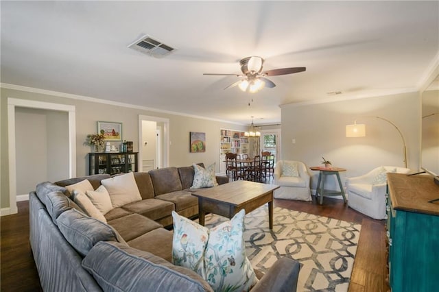 living room featuring ceiling fan, dark hardwood / wood-style floors, and ornamental molding