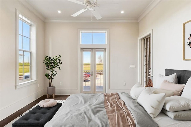 bedroom featuring ceiling fan, wood-type flooring, ornamental molding, and multiple windows