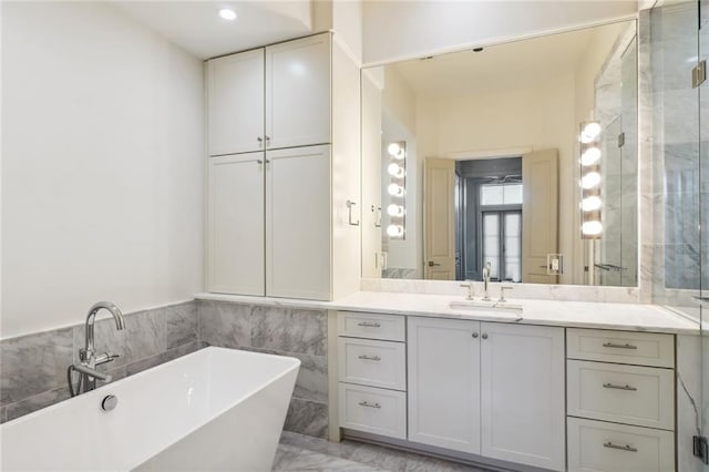 bathroom with plus walk in shower and vanity