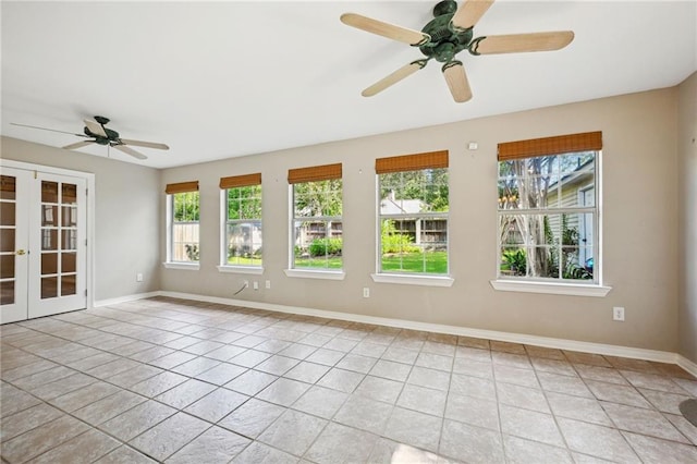 unfurnished room with light tile patterned floors, ceiling fan, and a healthy amount of sunlight