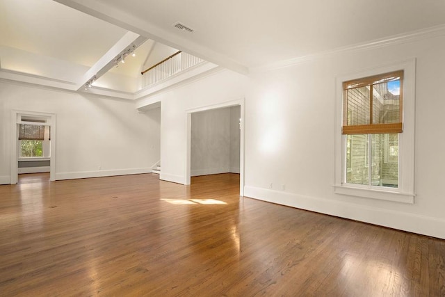 73527 Military Rd, Covington, LA 70435 - unfurnished living room featuring baseboards, stairs, track lighting, wood finished floors, and ornamental molding