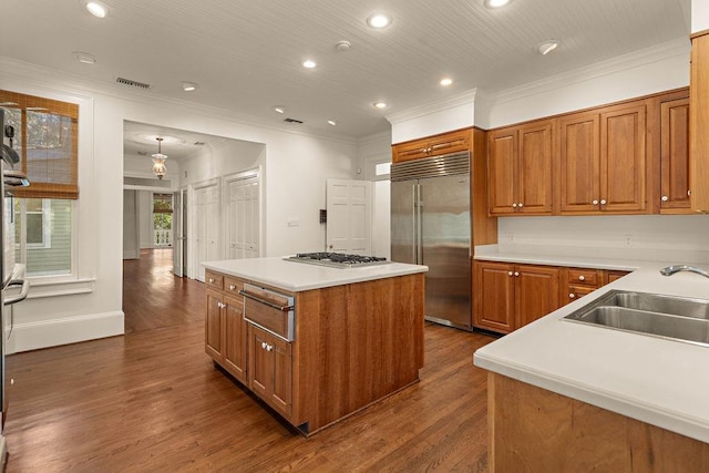 73527 Military Rd, Covington, LA 70435 - kitchen featuring stainless steel appliances, a warming drawer, a sink, ornamental molding, and recessed lighting