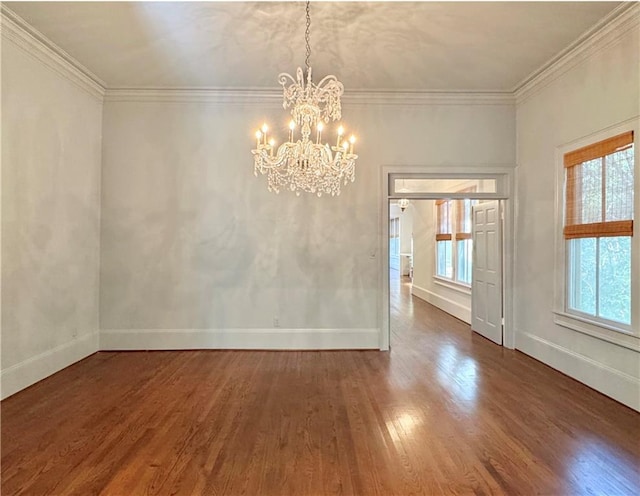 unfurnished dining area with ornamental molding, an inviting chandelier, and dark hardwood / wood-style floors