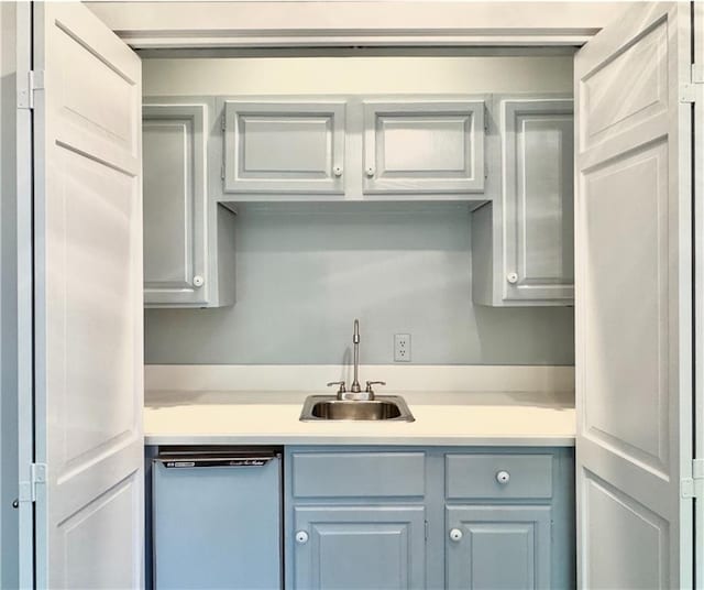73527 Military Rd, Covington, LA 70435 - kitchen with dishwasher, a sink, and light countertops