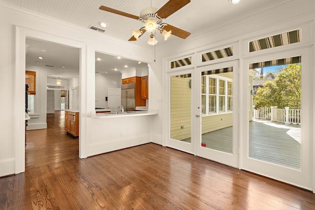 interior space with sink and ceiling fan