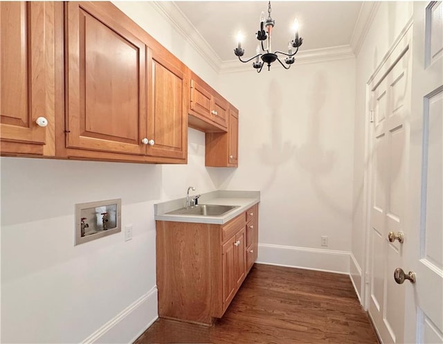 73527 Military Rd, Covington, LA 70435 - washroom featuring cabinet space, hookup for a washing machine, a chandelier, dark wood finished floors, and baseboards