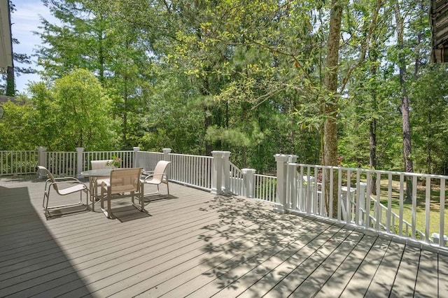 73527 Military Rd, Covington, LA 70435 - wooden terrace with outdoor dining area