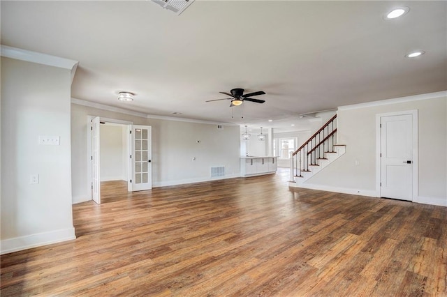 unfurnished living room featuring crown molding, hardwood / wood-style floors, and ceiling fan