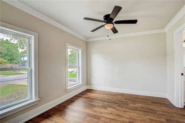 unfurnished room with ornamental molding, ceiling fan, dark hardwood / wood-style floors, and a healthy amount of sunlight