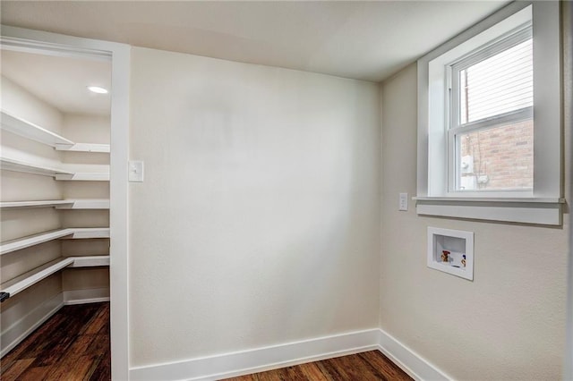 washroom featuring hookup for a washing machine and dark hardwood / wood-style flooring