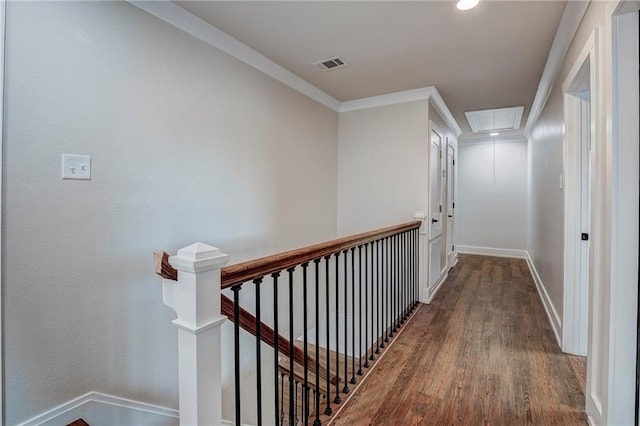 corridor featuring wood-type flooring and crown molding