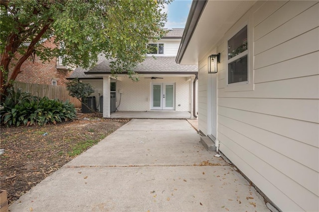 view of exterior entry with a patio and french doors