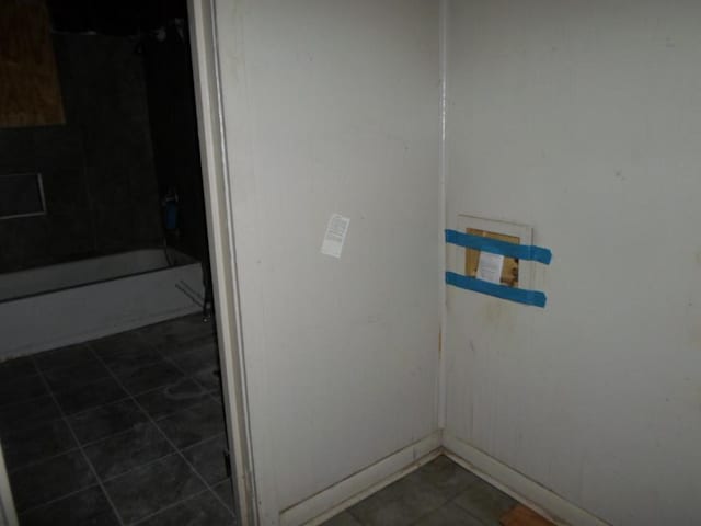 bathroom with  shower combination and tile patterned floors