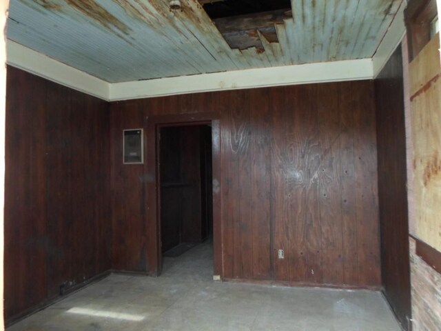 empty room with wooden walls and wooden ceiling