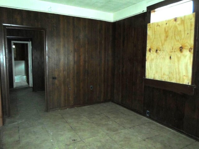 empty room with wood walls