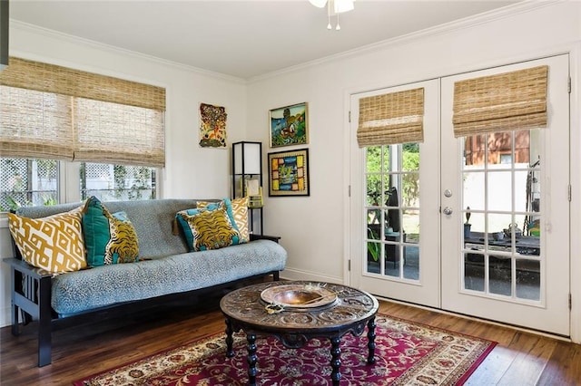 sitting room with hardwood / wood-style floors, plenty of natural light, and french doors