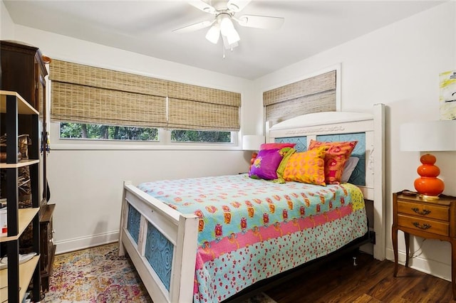 bedroom featuring ceiling fan and dark hardwood / wood-style floors