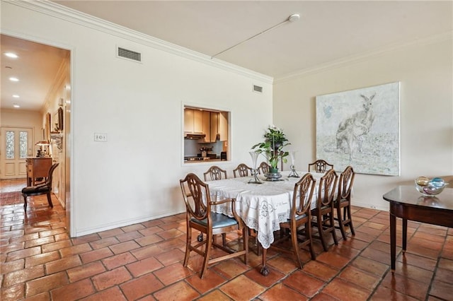 dining area featuring ornamental molding