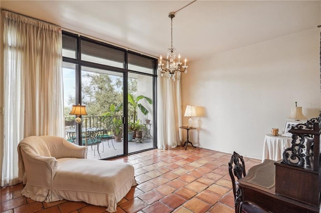 sitting room featuring expansive windows and a notable chandelier