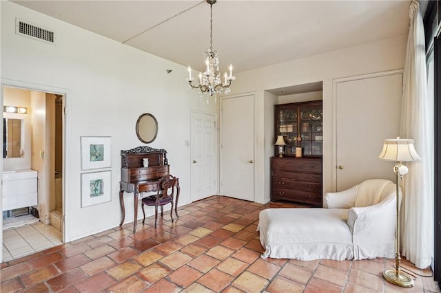 living area with an inviting chandelier