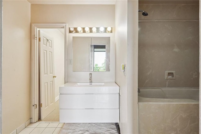 bathroom featuring vanity, tile patterned floors, and tiled shower / bath