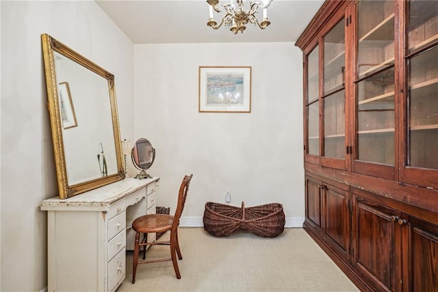 office area featuring light colored carpet and a notable chandelier