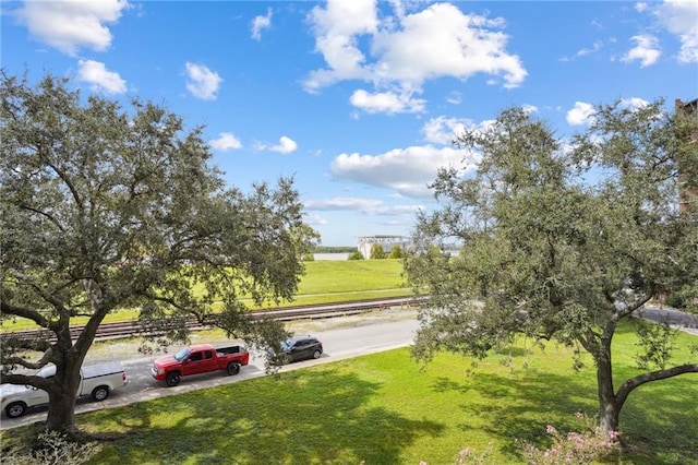 surrounding community featuring a lawn