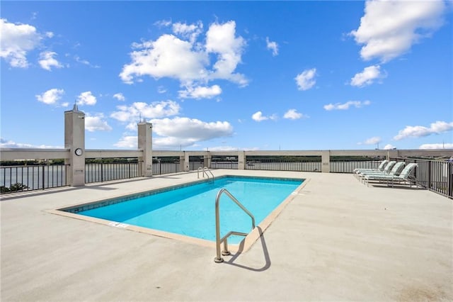 view of swimming pool with a patio