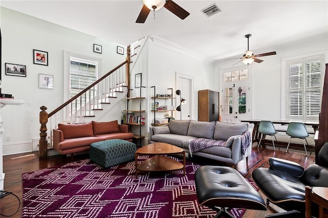 living room featuring ceiling fan, ornamental molding, and hardwood / wood-style floors