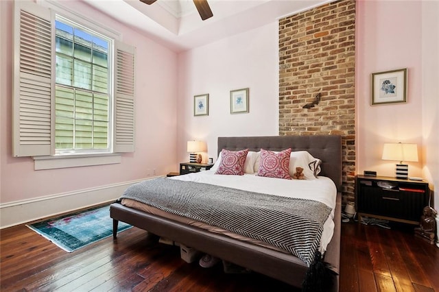 bedroom featuring ceiling fan and dark wood-type flooring