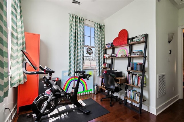 exercise area featuring dark hardwood / wood-style floors