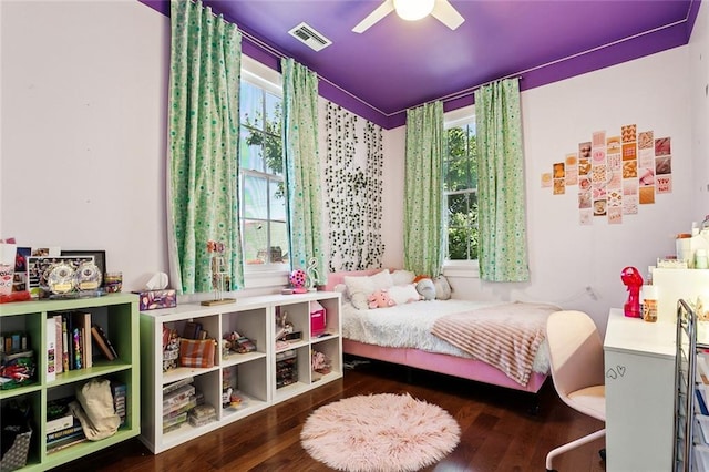 bedroom with ceiling fan and dark wood-type flooring