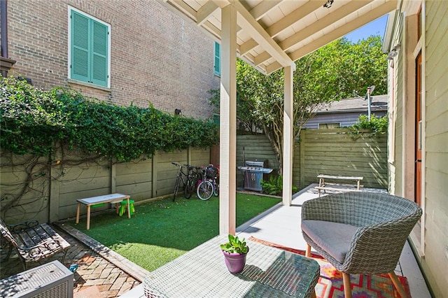 view of patio with a grill