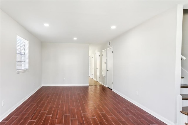 empty room featuring dark wood-type flooring