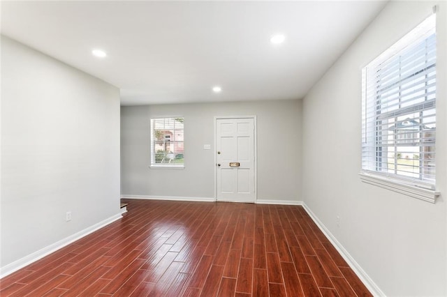 interior space featuring dark hardwood / wood-style floors and plenty of natural light