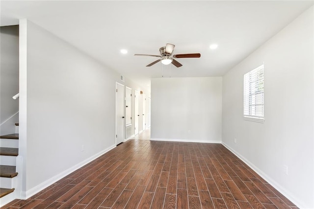 unfurnished room with ceiling fan and dark hardwood / wood-style floors