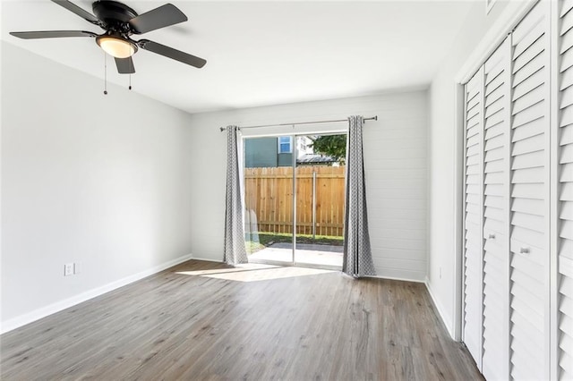 unfurnished room with ceiling fan and light hardwood / wood-style flooring