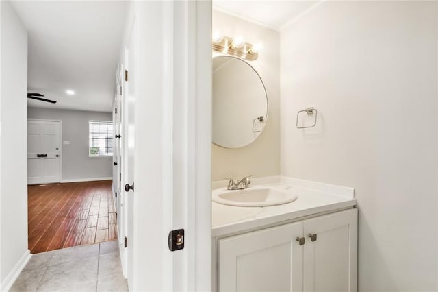 bathroom with hardwood / wood-style flooring and vanity