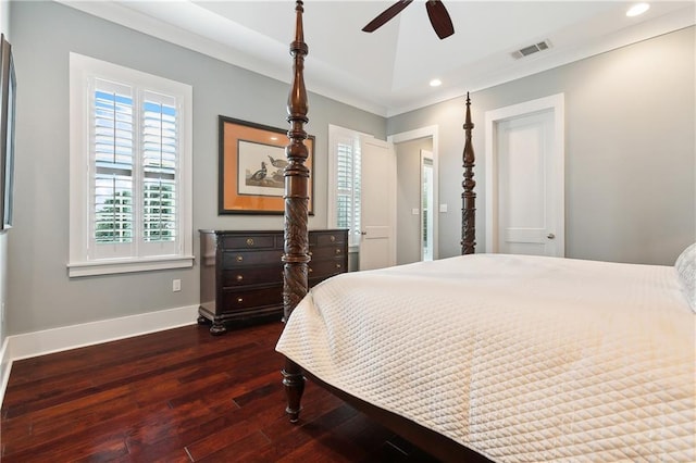 bedroom featuring ceiling fan, ornamental molding, and dark wood-type flooring