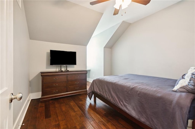 bedroom with vaulted ceiling, dark hardwood / wood-style floors, and ceiling fan