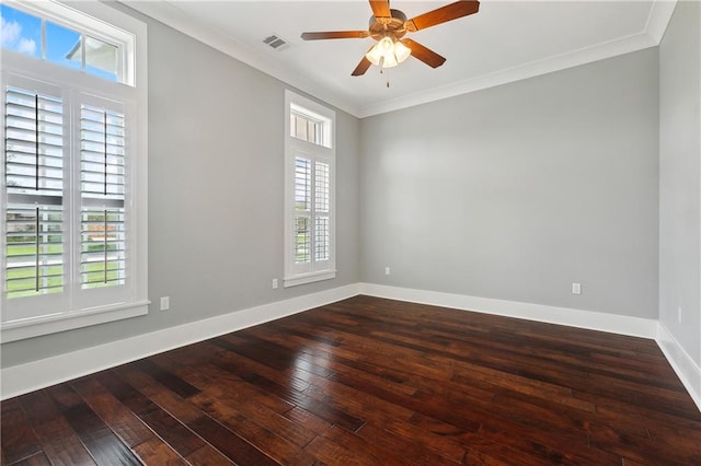 empty room featuring ceiling fan, hardwood / wood-style floors, and crown molding