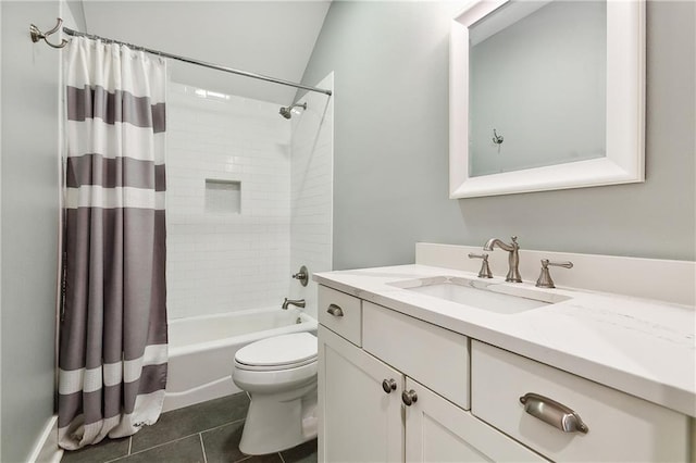 full bathroom featuring shower / bath combination with curtain, vaulted ceiling, tile patterned floors, vanity, and toilet