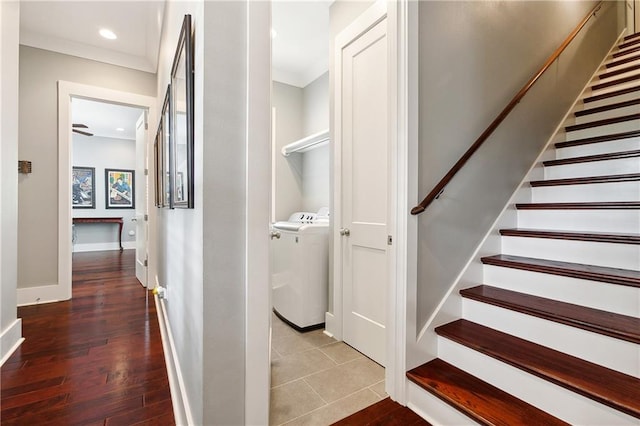 interior space with crown molding, hardwood / wood-style floors, and independent washer and dryer